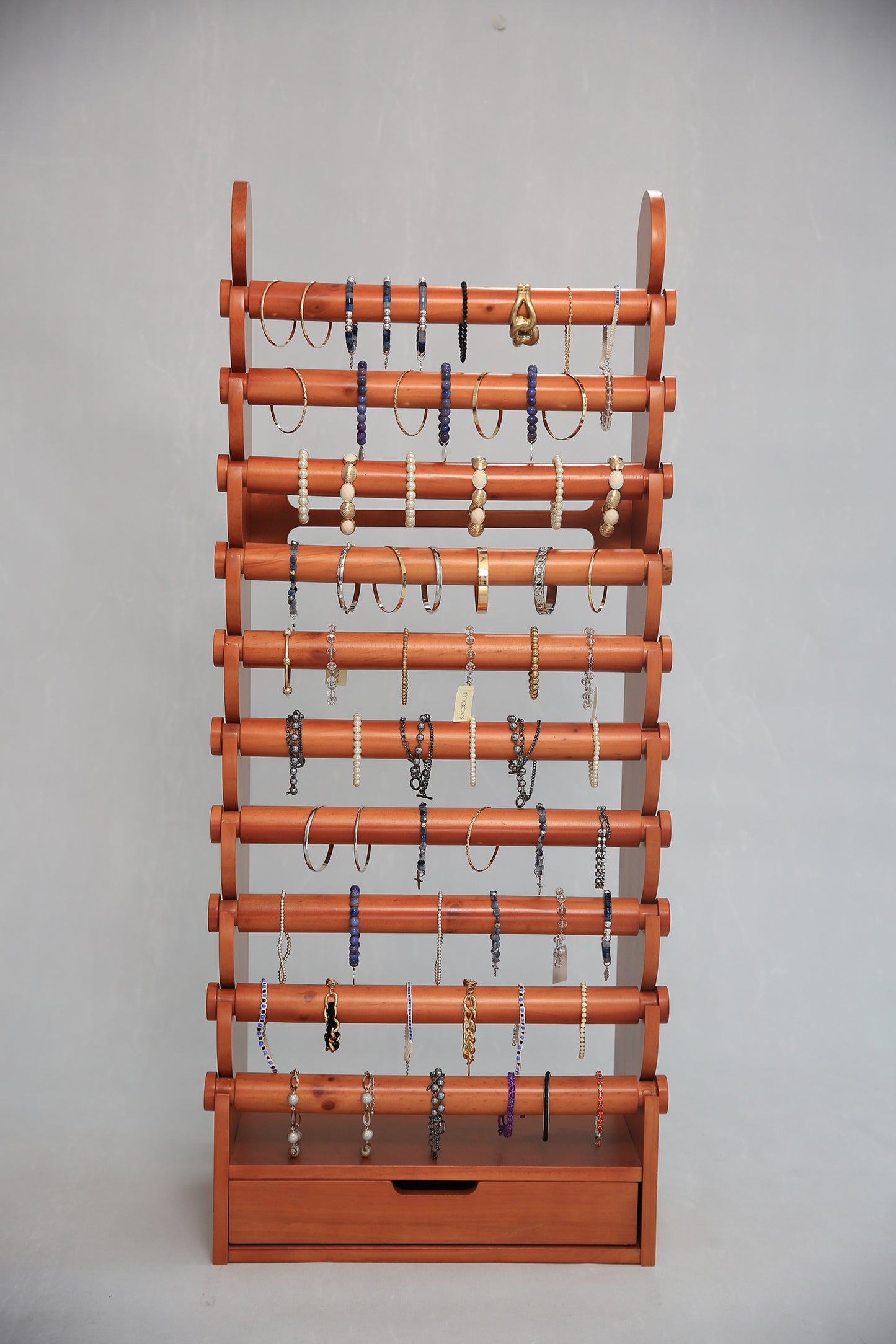 Luxury light wood jewelry display stand with storage drawer, ideal for boutiques, vendors, and collectors
