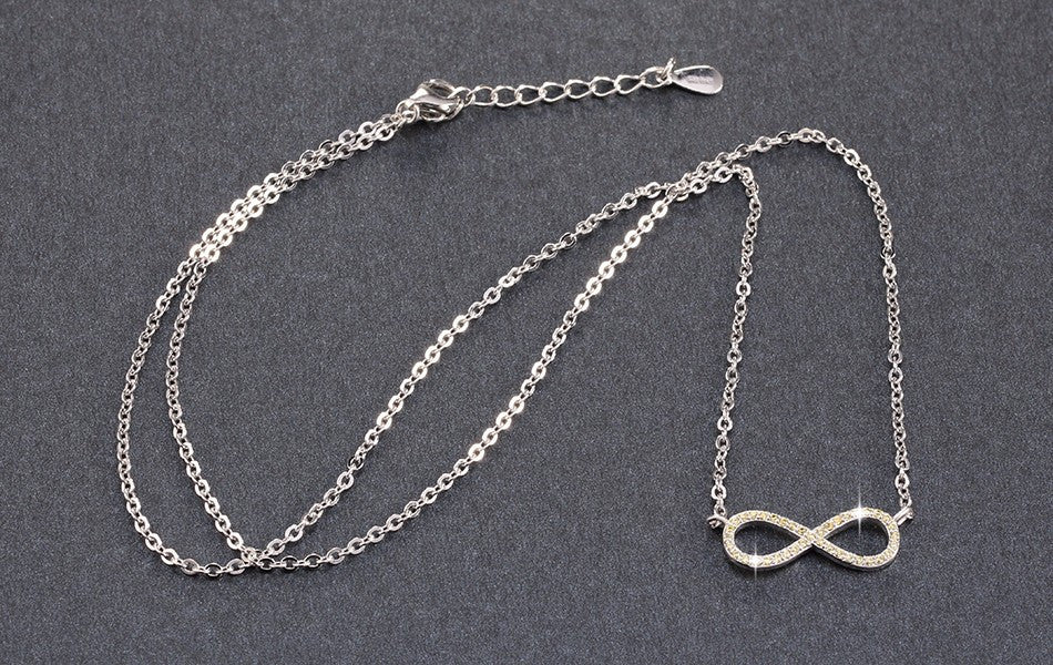 Silver Infinity Symbol Necklace with Yellow Zircon Crystals